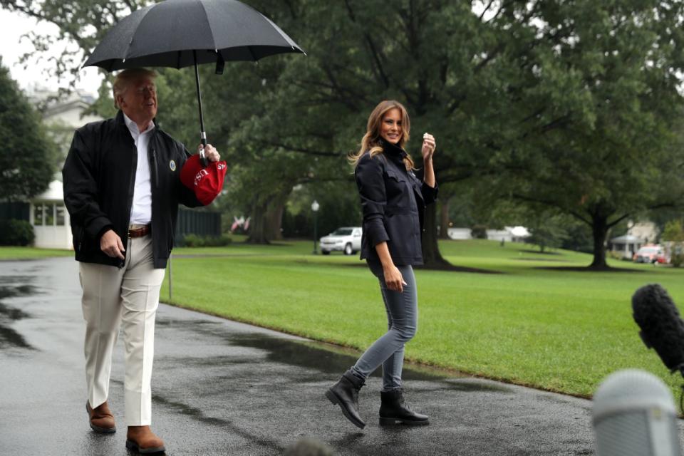 First Lady Melania Trump was left standing in the rain as her husband Donald Trump walked off taking the umbrella. Source: Getty