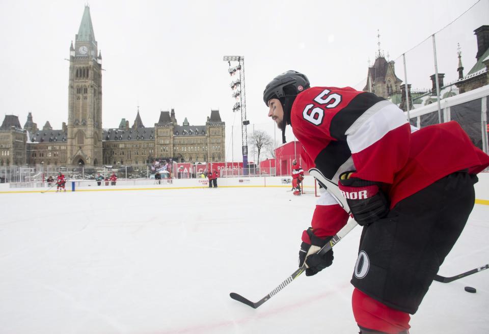 <p>Erik Karlsson soaks in the view while waiting for a pass during the Senators’ practice on Parliament Hill on Friday. </p>