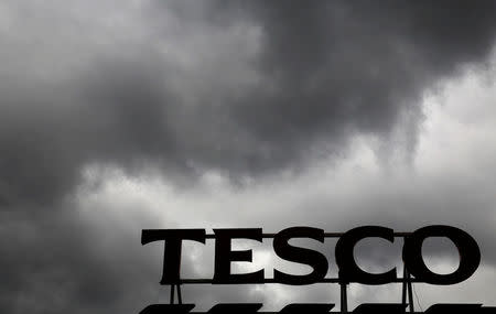 FILE PHOTO: Grey clouds hang over a Tesco Extra store in London, Britain June 4, 2014. REUTERS/Luke MacGregor/File Photo