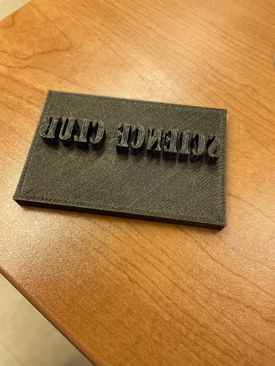 SCC Science Club member Matt Smith used a 3-D printer to make a stamp for the club's handmade soaps.