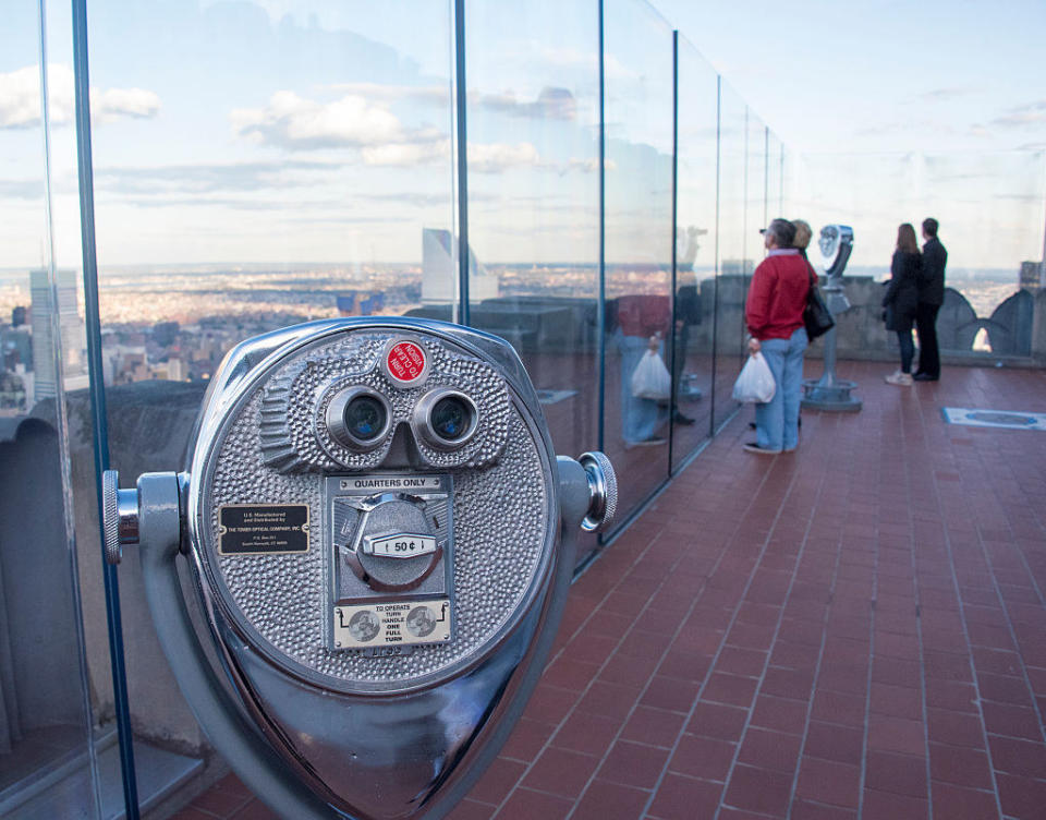 top of the Empire State building with the machine to view the whole city