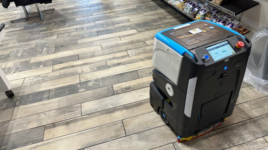 A robot cleans the floor at a J&H in Coopersville. (Feb. 12, 2024)