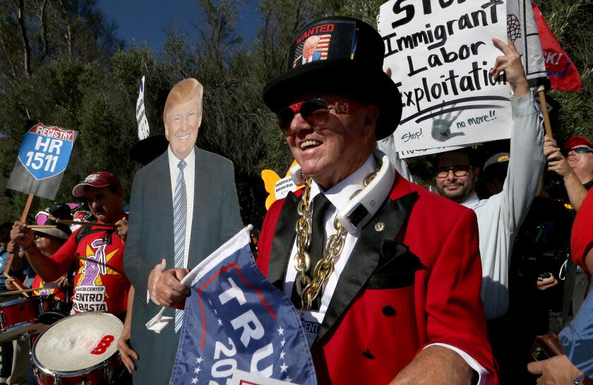 Simi Valley, CA - Immigration rights activists and supporters of foremr president Donald J. Trump crowd the corner of Madera Road and Presidential Drive as GOP presidential candidates debate Wednesday, Sept. 27, 2023, at the Ronald Reagan Presidential Library in Simi Valley. Trump was not present at the second GOP presidential debate, which featured Florida Gov. Ron DeSantis, former Vice President Mike Pence, former U.N. Ambassador Nikki Haley, South Carolina Sen. Tim Scott and former New Jersey Gov. Chris Christie. (Luis Sinco / Los Angeles Times)