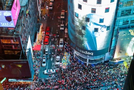 Aerialist Wallenda walks the highwire with his sister Lijana over Times Square in New York