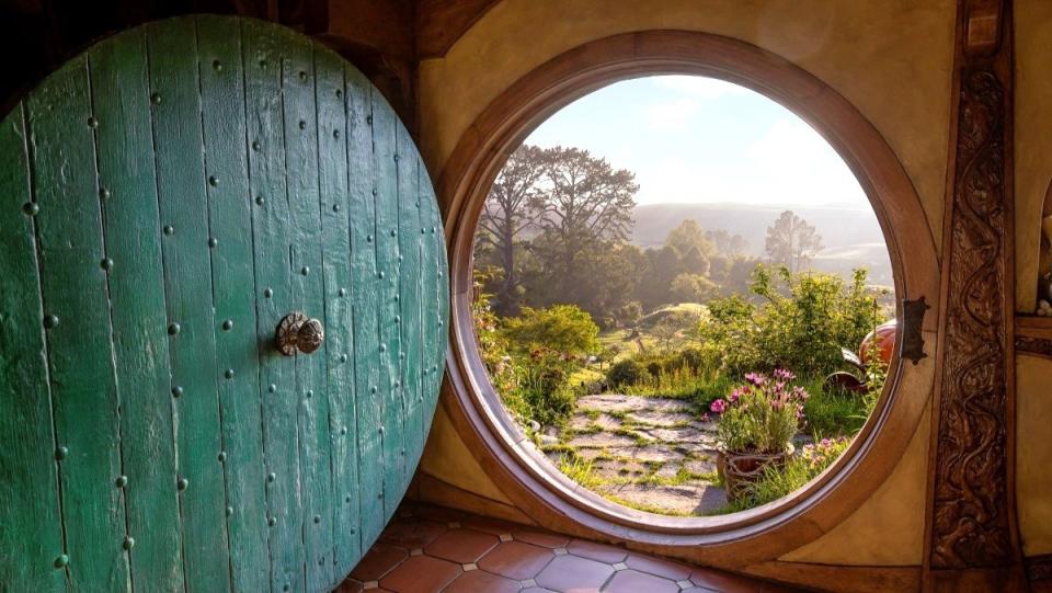 Looking out a round front door on the Hobbit movie set in New Zealand