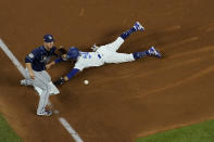 Los Angeles Dodgers right fielder Mookie Betts steals third past Tampa Bay Rays third baseman Joey Wendle during the fifth inning in Game 1 of the baseball World Series Tuesday, Oct. 20, 2020, in Arlington, Texas. (AP Photo/David J. Phillip)