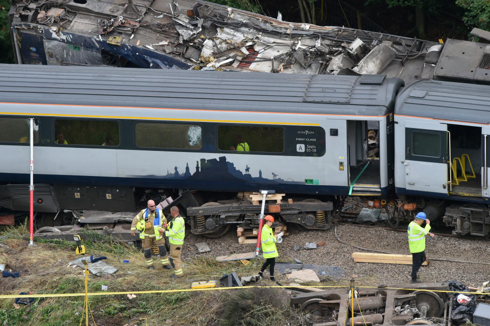 Emergency services inspect the site, following the derailment of the ScotRail train which cost the lives of three people, near Stonehaven, Aberdeenshire, Scotland, Britain August 13, 2020. Ben Birchall/Pool via REUTERS