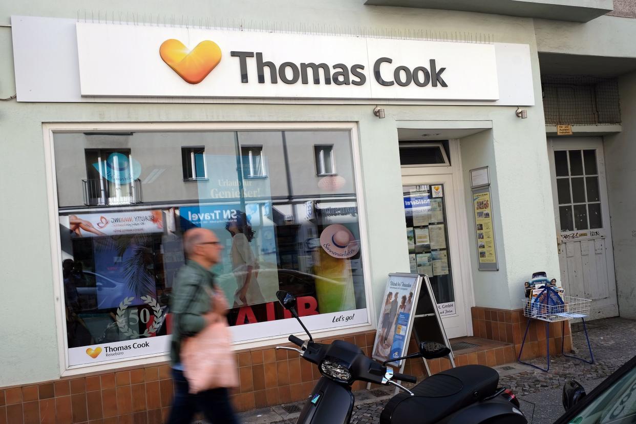 A man walks past a travel agency store that offers the travel services of Thomas Cook on September 26, 2019 in Berlin, Germany.