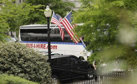 A bus transporting members of the U.S. Senate arrives for a classified briefing on North Korea at the White House in Washington, U.S, April 26, 2017. REUTERS/Kevin Lamarque