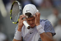 Denmark's Holger Rune adjusts his cap during the quarterfinal match of the French Open tennis tournament against Norway's Casper Ruud at the Roland Garros stadium in Paris, Wednesday, June 7, 2023. (AP Photo/Christophe Ena)