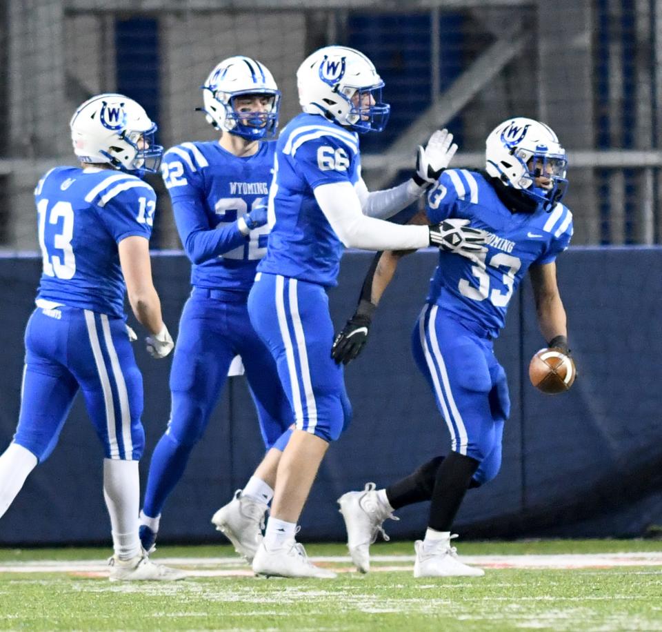 Wyoming running back CJ Hester (33) celebrates his Division IV-championship-game record 81-yard TD run in the first quarter vs. Glenville at Tom Benson Hall of Fame Stadium. Saturday, Dec. 3, 2022.