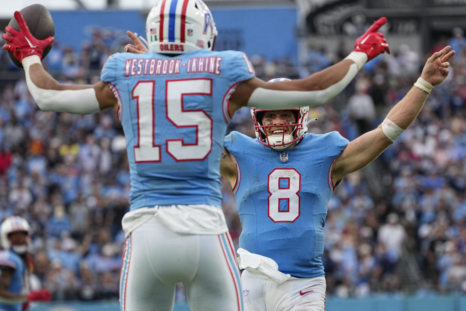 Tennessee Titans quarterback Will Levis (8) celebrates after throwing a touchdown pass to wide receiver Nick Westbrook-Ikhine (15) during the second half of an NFL football game against the Atlanta Falcons, Sunday, Oct. 29, 2023, in Nashville, Tenn. (AP Photo/George Walker IV)