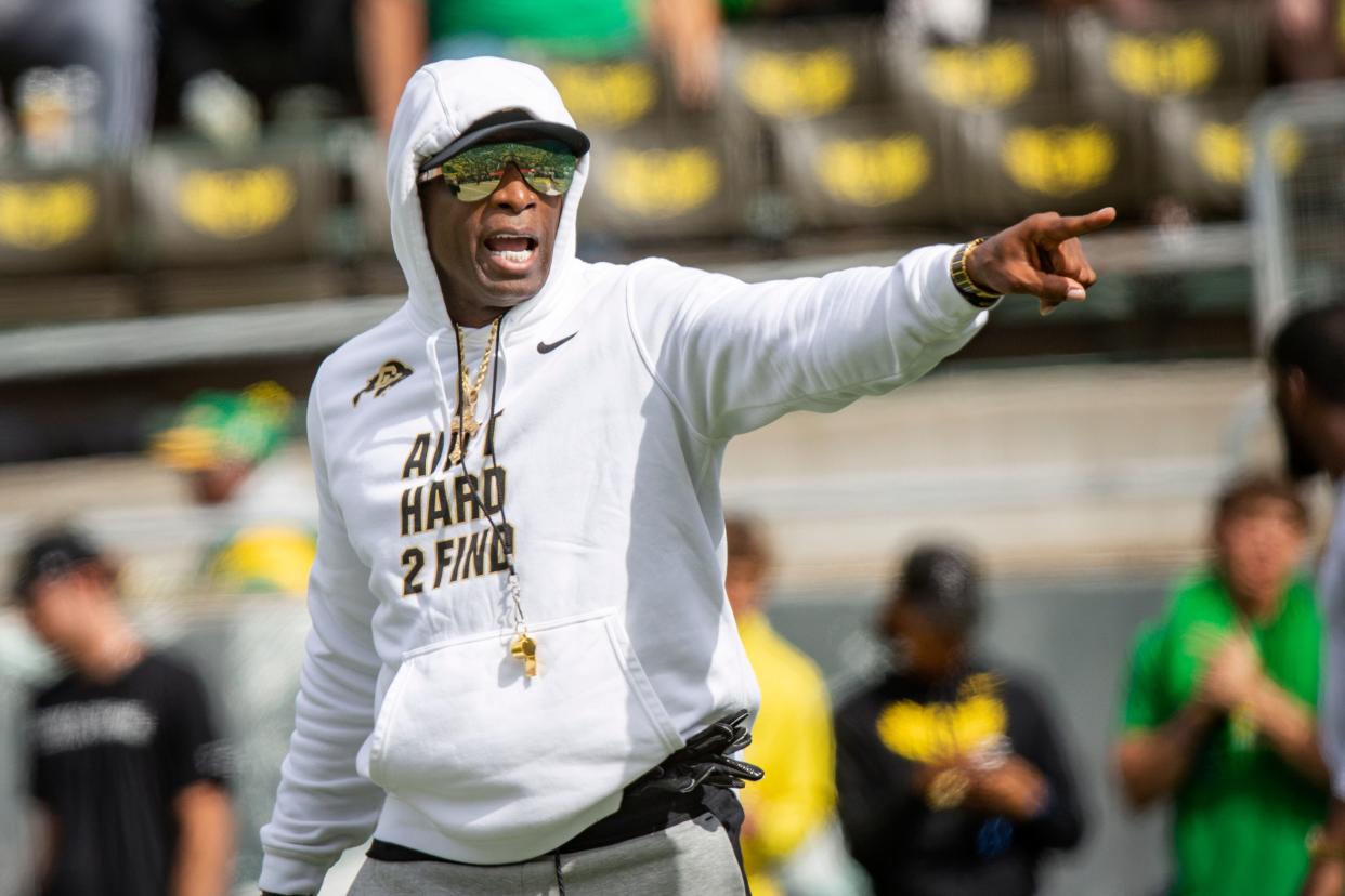 Colorado head coach Deion Sanders walks the field during warm ups as the Oregon Ducks host Colorado in the Pac-12 opener Saturday, Sept. 23, 2023, at Autzen Stadium in Eugene, Ore.