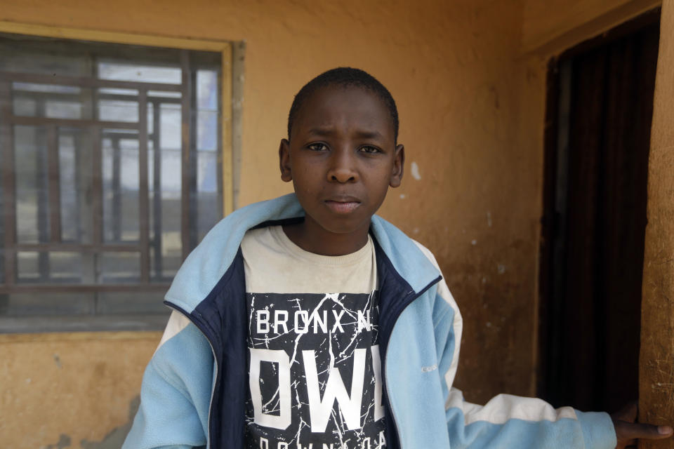 Abdulganiyu Hassan, one of the freed students, looks on during an interview to Associated Press as he returns home to his family in Ketare, Nigeria, Saturday Dec. 19, 2020. While in the bush he was thinking about his parents siblings, friends and the way we use to play and pray together back home. Nigeria's freed schoolboys have reunited with their joyful parents after being held captive for nearly a week by gunmen allied with jihadist rebels in the country's northwest. Relieved parents hugged their sons tightly on Saturday in Kankara, where more than 340 boys were abducted from the Government Science Secondary school on the night of Dec. 11. (AP Photo/Sunday Alamba)