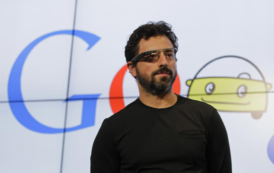 Google co-founder and former Alphabet executive Sergey Brin stands on stage during a bill signing by California Gov. Edmund G. Brown Jr., for driverless cars at Google headquarters in Mountain View, Calif., Tuesday, Sept. 25, 2012.  The legislation will open the way for driverless cars in the state. Google, which has been developing autonomous car technology and lobbying for the legislation has a fleet of driverless cars that has logged more than 300,000 miles (482,780 kilometers) of self-driving on California roads. (AP Photo/Eric Risberg)