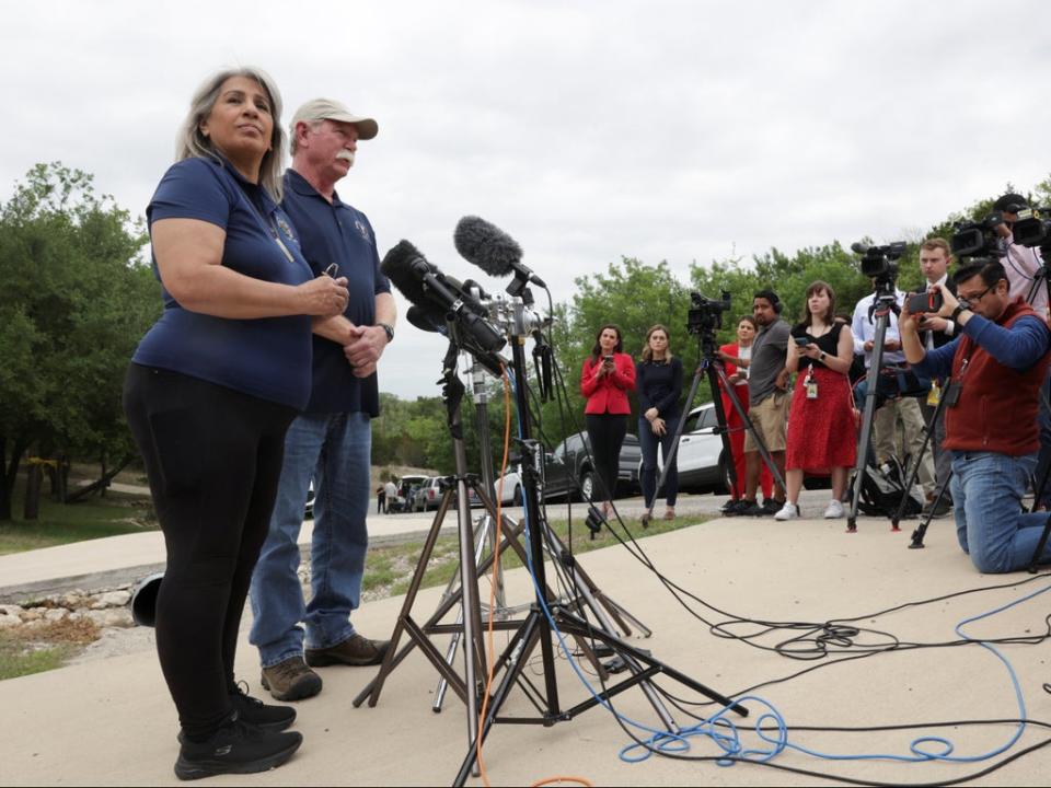 Paula and Joey Reed speaking with reporters outside their home (REUTERS)