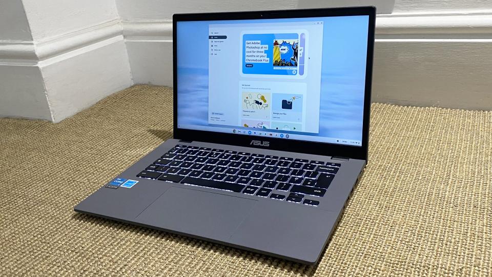 Asus Chromebook Plus laptop on a beige patterned surface