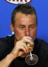 Australia's Lleyton Hewitt drinks champagne during a news conference after playing his last Australian Open singles match before his retirement, at the Australian Open tennis tournament at Melbourne Park, Australia, January 21, 2016. REUTERS/Issei Kato