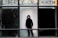 An anti-government protester poses for a photo at the Polytechnic University in Hong Kong