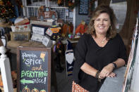 Ginger Pigg in her gift boutique The Perfect Pigg in Cumming, Ga. on Thursday afternoon, Oct. 22, 2021. She says she is struggling to get products to her store in a timely way. (AP Photo/Ben Gray)