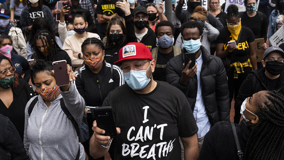 A crowd, pictured here listening as speaker during a protest after the death of George Floyd.