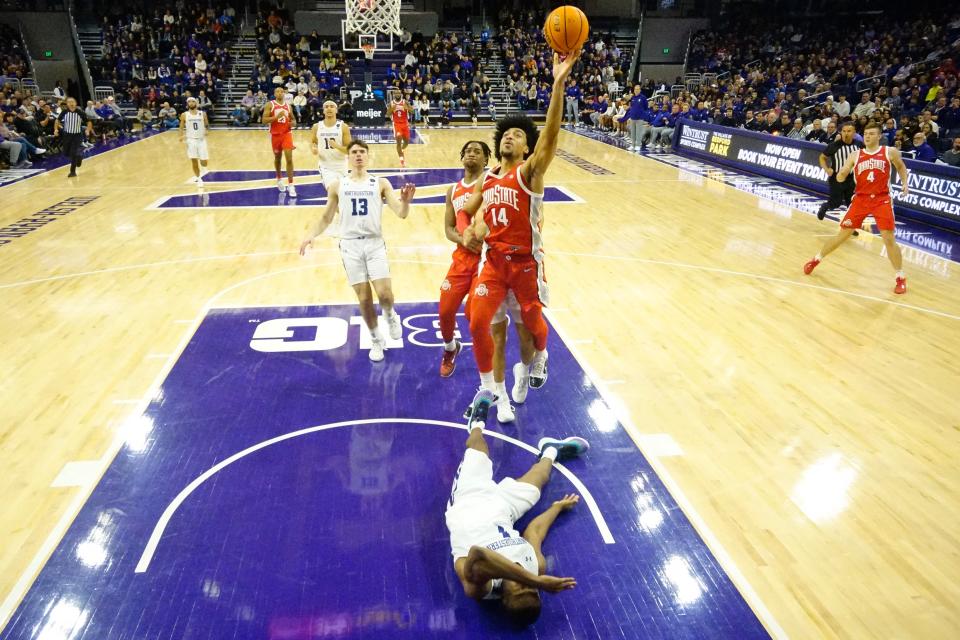 Ohio State's Justice Sueing shoots over Northwestern's Chase Audige.