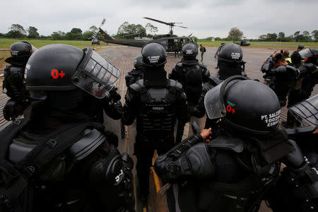 Colombian police are preparing to make an operation against illegal mining in Tumaco, Colombia December 5, 2017. REUTERS/Jaime Saldarriaga