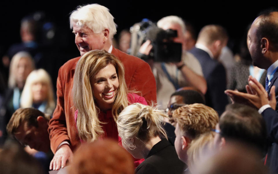 Carrie Symonds, partner of Britain's Prime Minister Boris Johnson smiles as she arrives to listen to him deliver his Leader's speech at the Conservative Party Conference in Manchester, England, Wednesday, Oct. 2, 2019. Britain's ruling Conservative Party is holding their annual party conference. (AP Photo/Frank Augstein)