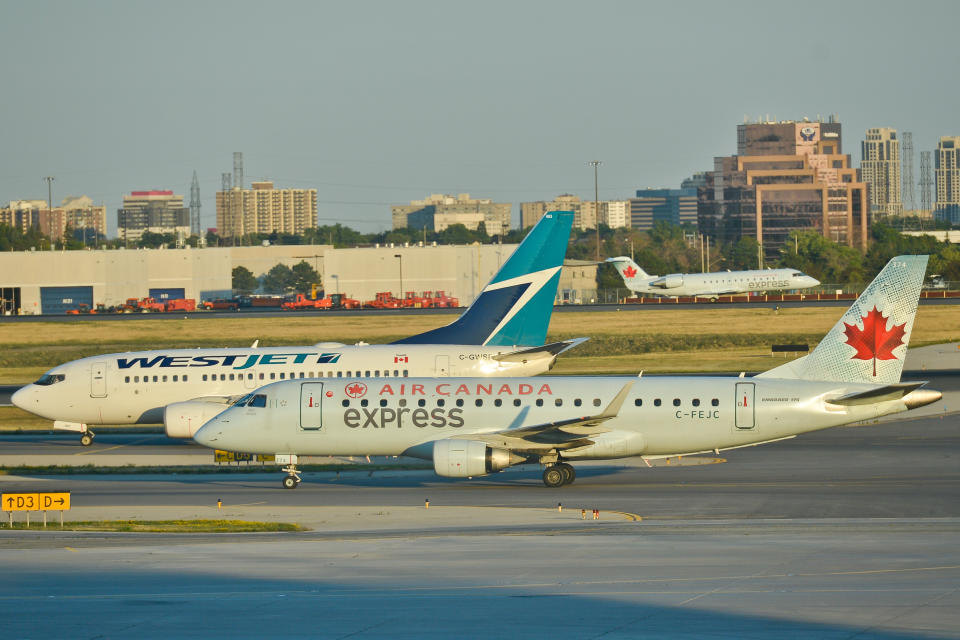A view of Air Canada and WestJet planes at Toronto Pearson International Airport. On Wednesday, 20 July 2016, in Toronto, Canada. (Photo by Artur Widak/NurPhoto via Getty Images)