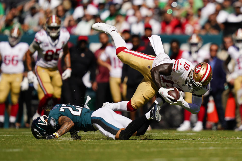 San Francisco 49ers wide receiver Deebo Samuel (19) is tackled by Philadelphia Eagles safety Marcus Epps (22) during the first half of an NFL football game Sunday, Sept. 19, 2021, in Philadelphia. (AP Photo/Matt Slocum)