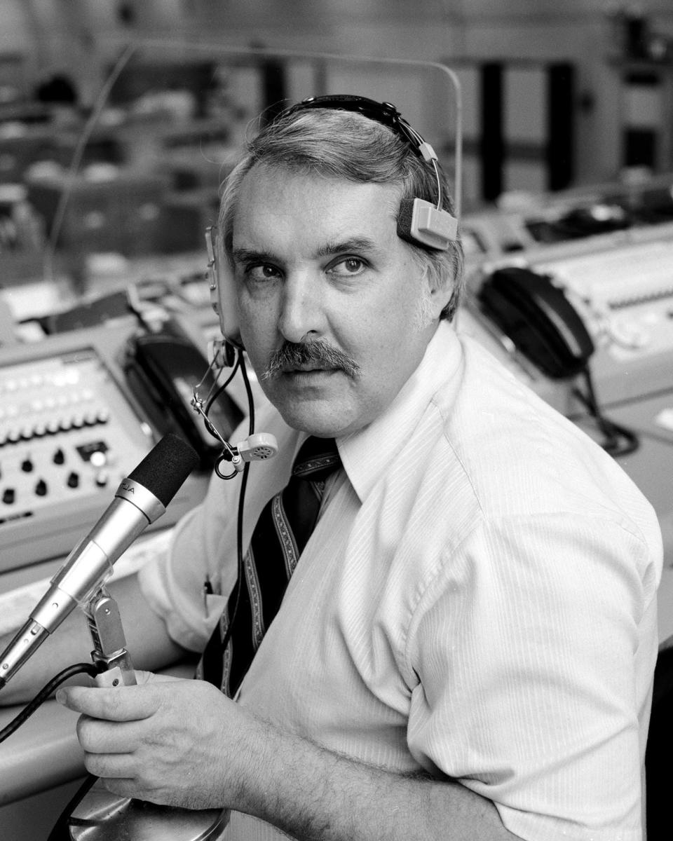 In this 1981 photo, Hugh Harris is seen at his console in a firing room at Kennedy Space Center's Launch Control Center. He was the third director of public affairs at KSC and provided mission commentary for space shuttle launches.