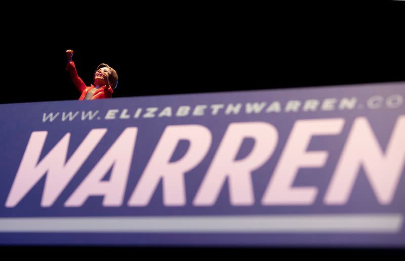 A figurine of U.S. Democratic presidential candidate Senator Elizabeth Warren sits on the podium during a campaign rally in Denver