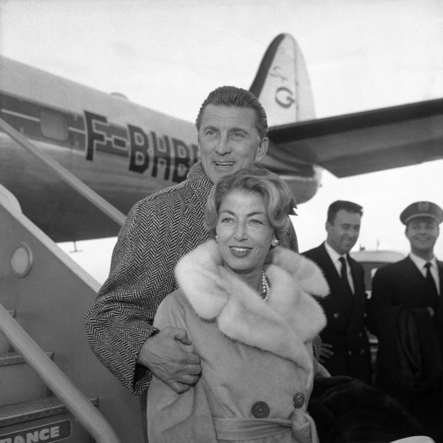 Hollywood’s Kirk Douglas and his wife Anne Douglas, formally Anne Buydens arrive at London Airport on Dec. 5, 1960, from Paris. They have flown over for the premiere of Douglas' film “Spartacus” at the Metropole cinema, London on Wednesday in evening. Douglas stars in the movie with Jean Simmons, unseen. (AP Photo)