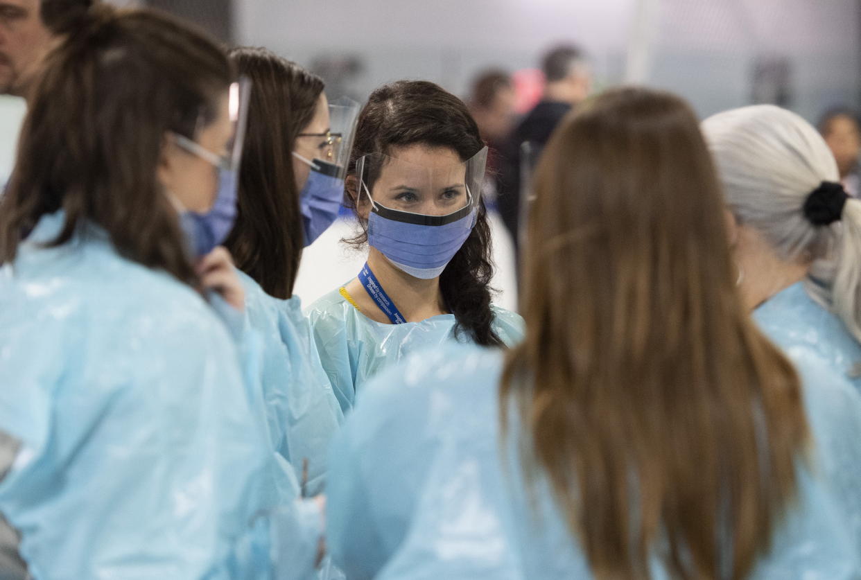 Medical staff prepare for the opening of the COVID-19 Assessment Centre at Brewer Park Arena in Ottawa, during a media tour on Friday, March 13, 2020. A Toronto hospital is accepting donations of face masks and other protective gear from members of the public in an effort to ward off what some say is an impending shortage. THE CANADIAN PRESS/Justin Tang