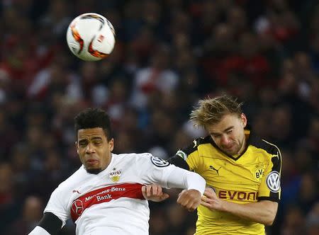 Football Soccer - VfB Stuttgart v Borussia Dortmund - German Cup (DFB Pokal) - Mercedes-Benz Arena, Stuttgart, Germany - 09/ 02/16 VfB Stuttgart's Daniel Didavi and Borussia Dortmund's Marcel Schmelzer in action REUTERS/Kai Pfaffenbach