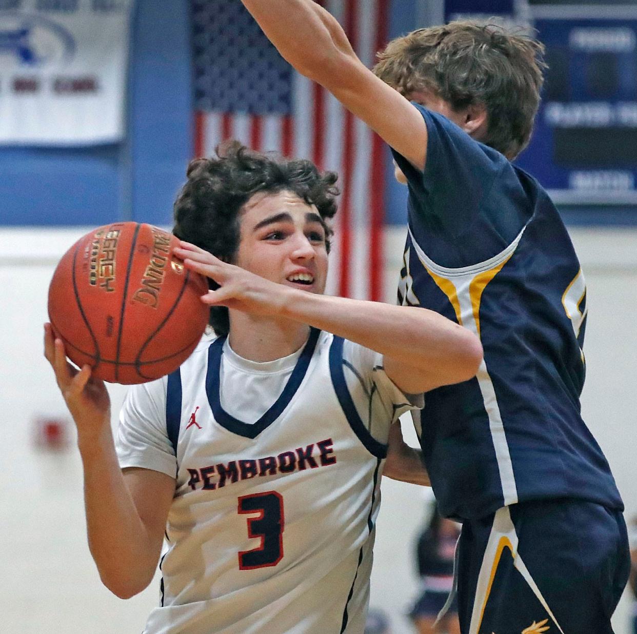 Titan captain Matthew Delcore tries to get a shot past Hawk Owen Barth under the basket.
The Pembroke Titans hosted Hanover Hawks in boys basketball action Friday Jan. 19, 2024