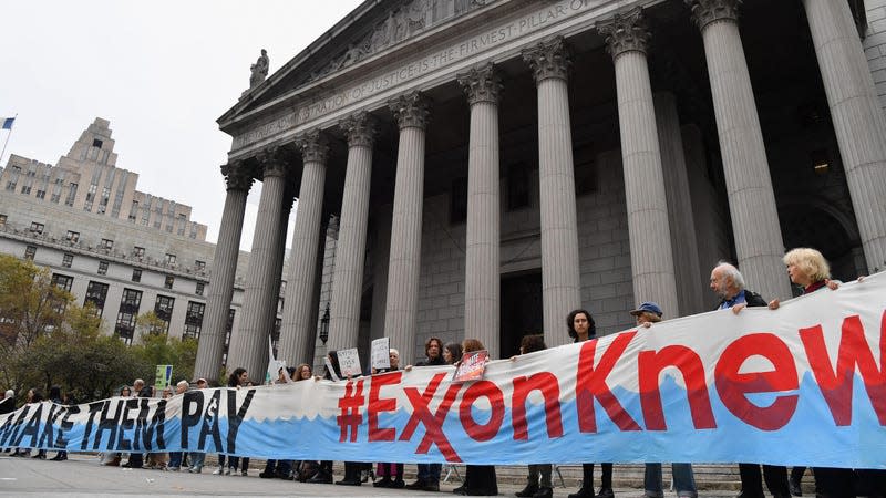 Climate activists protest on the fist day of the ExxonMobil trial outside the New York State Supreme Court building on October 22, 2019 in New York City.