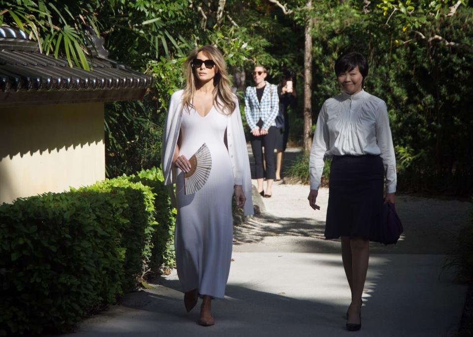 <p>The FLOTUS was seen wearing a long white dress and matching cardigan on a recent visit to the Morikami Museum and Japanese Gardens with Akie Abe, the wife of Prime Minister Shinzo Abe of Japan.</p>