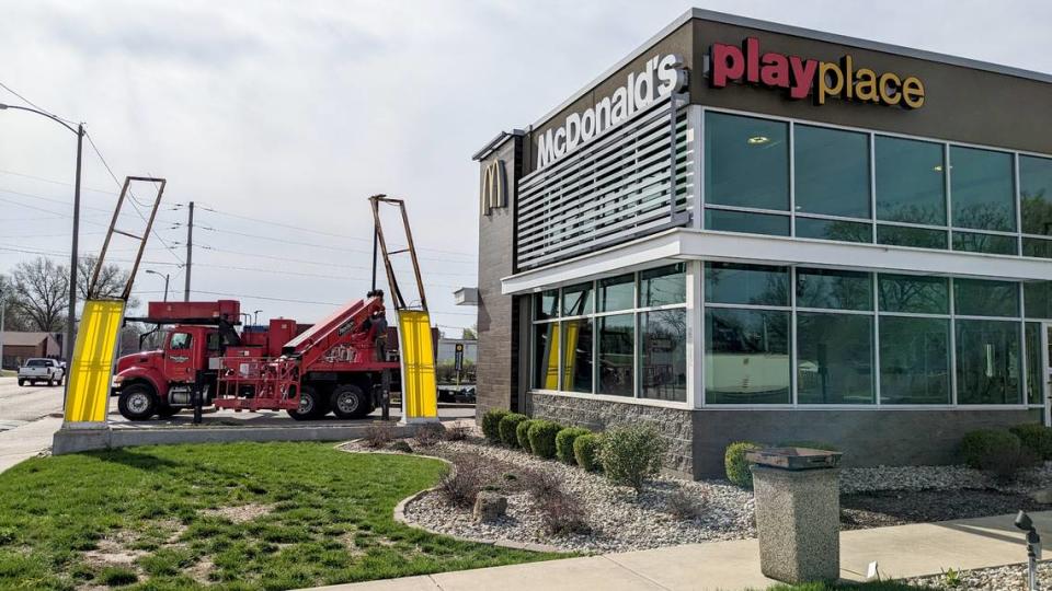 Piros Signs takes down the arch sign at the recently closed McDonald’s on West Main Street in Belleville.