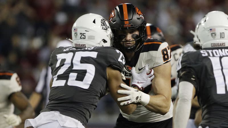Oregon State tight end Riley Sharp (87) blocks Washington State defensive back Jaden Hicks (25) during the second half of an NCAA college football game, Saturday, Sept. 23, 2023, in Pullman, Wash. 