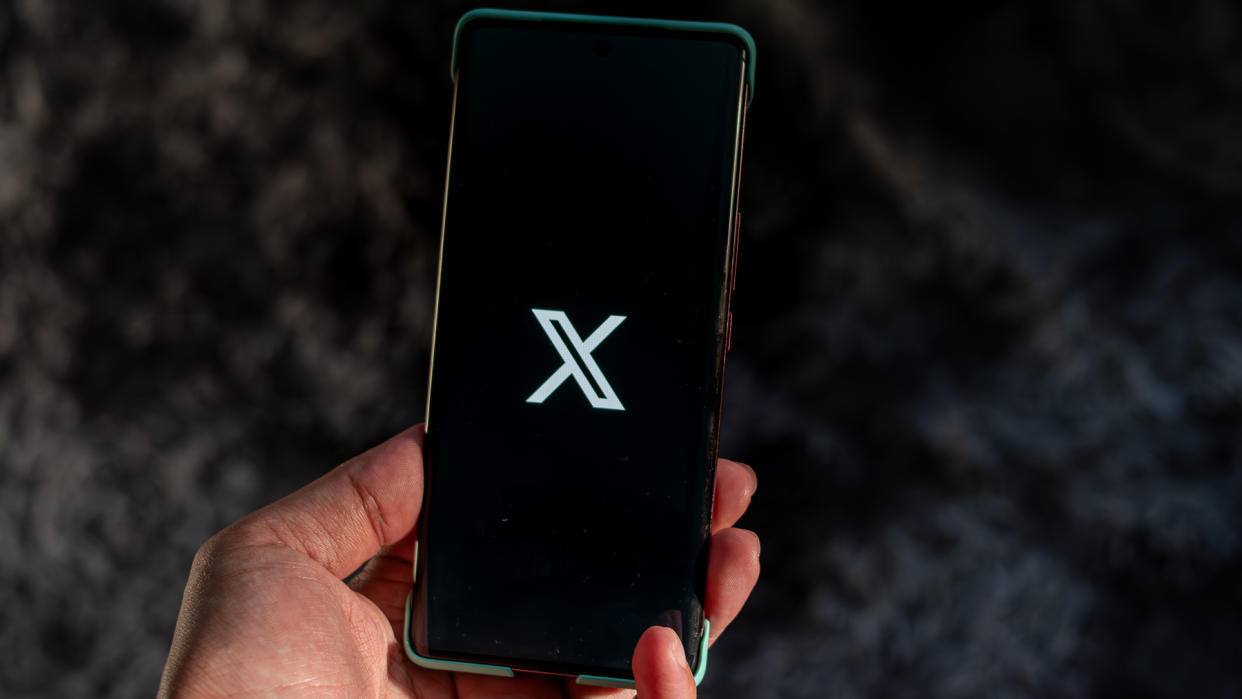  X logo on a phone screen. 