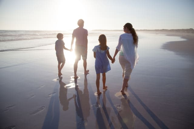 Family walking together on a beach