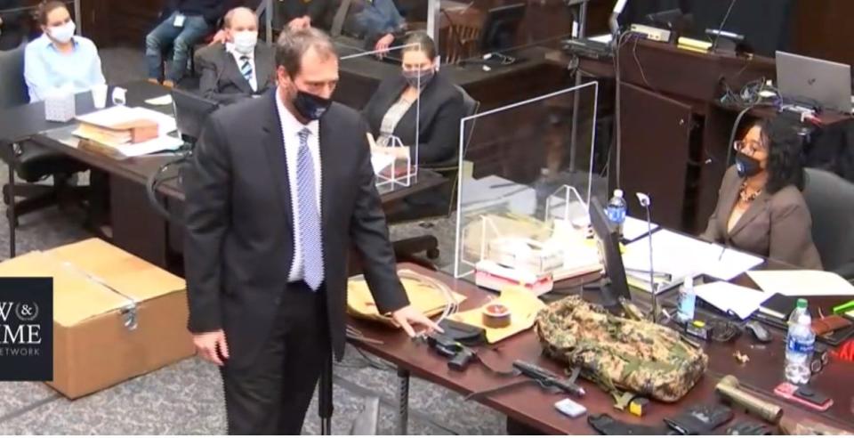 Assistant Sumit County Prosecutor Brian LoPrinzi points to the stun gun, knife, zip ties and other items used in 2012 slaying of Ashley Biggs during Erica Stefanko's first trial in November 2020. Stefanko will be retried starting Tuesday for her alleged role in Biggs' slaying.