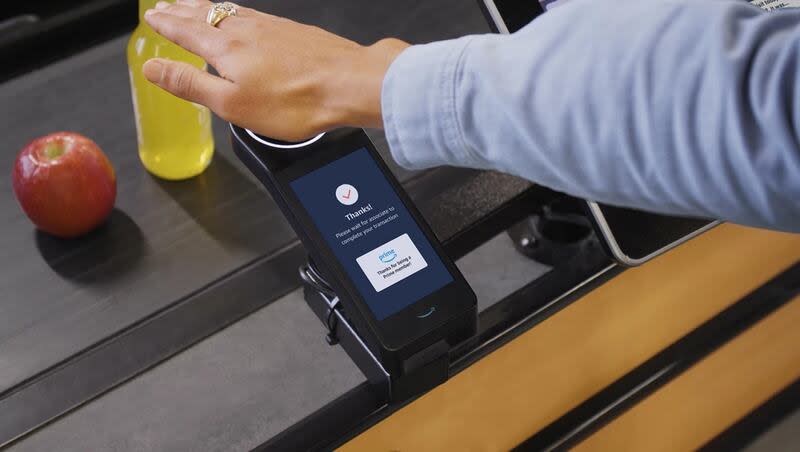 A biometric scanner is pictured in a news release from Whole Foods.