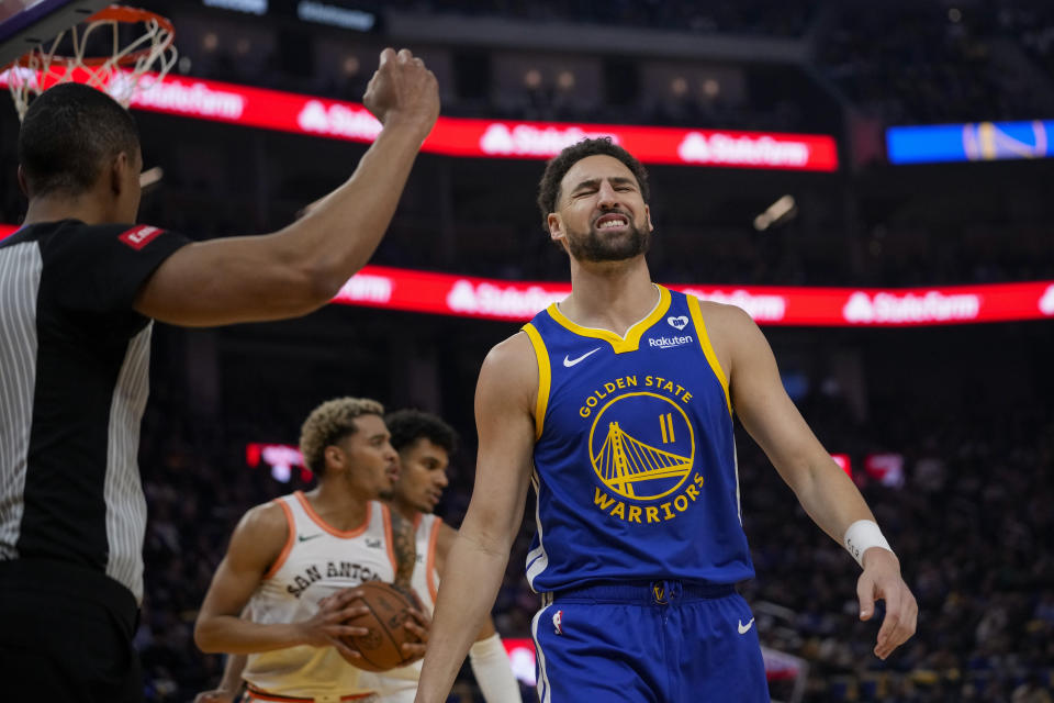 Golden State Warriors guard Klay Thompson (11) reacts during the first half of an NBA basketball game against the San Antonio Spurs, Saturday, March 9, 2024, in San Francisco. (AP Photo/Godofredo A. Vásquez)