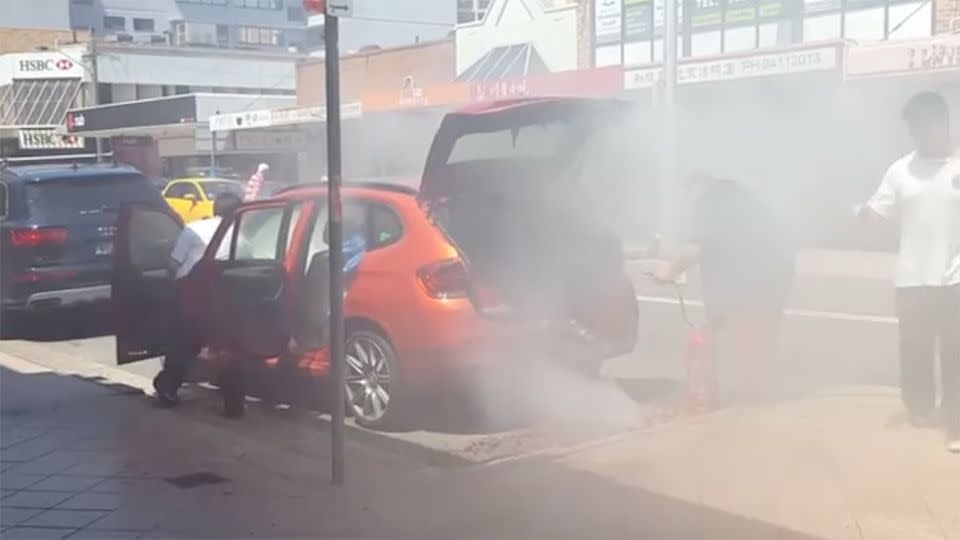 The man extinguishing the fireworks was sent ducking for cover when the smoke became too intense. Source: Facebook