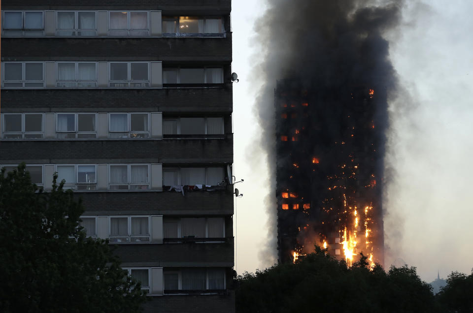 <p>Smoke and flames rise from a building on fire in London, Wednesday, June 14, 2017. Metropolitan Police in London say they’re continuing to evacuate people from a massive apartment fire in west London. The fire has been burning for more than three hours and stretches from the second to the 27th floor of the building. (Matt Dunham/AP) </p>