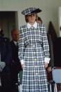 <p>Even when Princess Diana wore more subdued colors, she still went big. Case in point: This matching Catherine Walker hat-and-dress combo she wore to the Braemar Games in Scotland in 1989.</p>