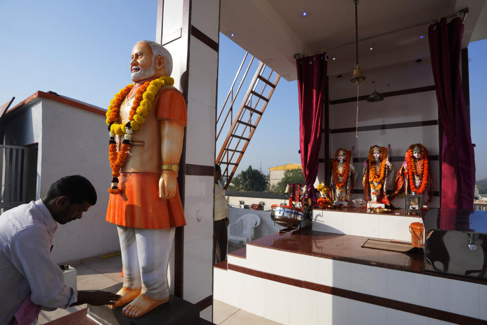 Mohanlal Gupta, a scrap trader, worships a statue of Indian Prime Minister Narendra Modi at a temple he has built on the third floor of his residential building at Gadkhol village near Ankleshwar in Baruch district of Gujarat state, India, Feb. 5, 2024. With approval ratings over 70%, Modi’s popularity has eclipsed that of his party. Supporters see him as a strongman leader, unafraid to take on India’s enemies, from Pakistan to the liberal elite. (AP Photo/Ajit Solanki, File)