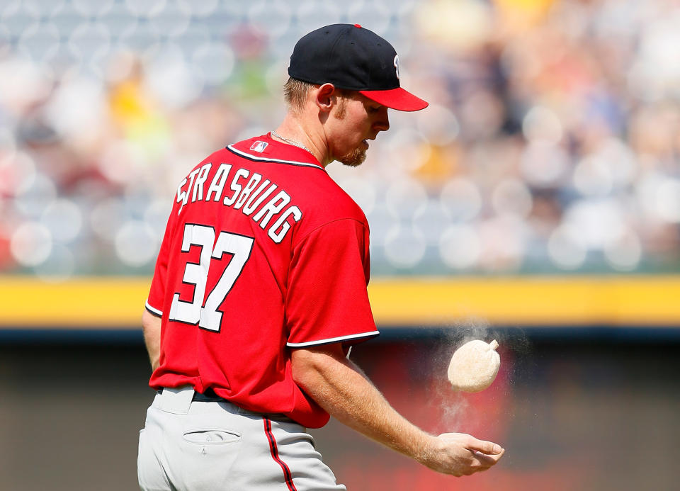 ATLANTA, GA - JUNE 30: Stephen Strasburg #37 of the Washington Nationals tosses some rosin on his right hand in the second inning against the Atlanta Braves at Turner Field on June 30, 2012 in Atlanta, Georgia. (Photo by Kevin C. Cox/Getty Images)
